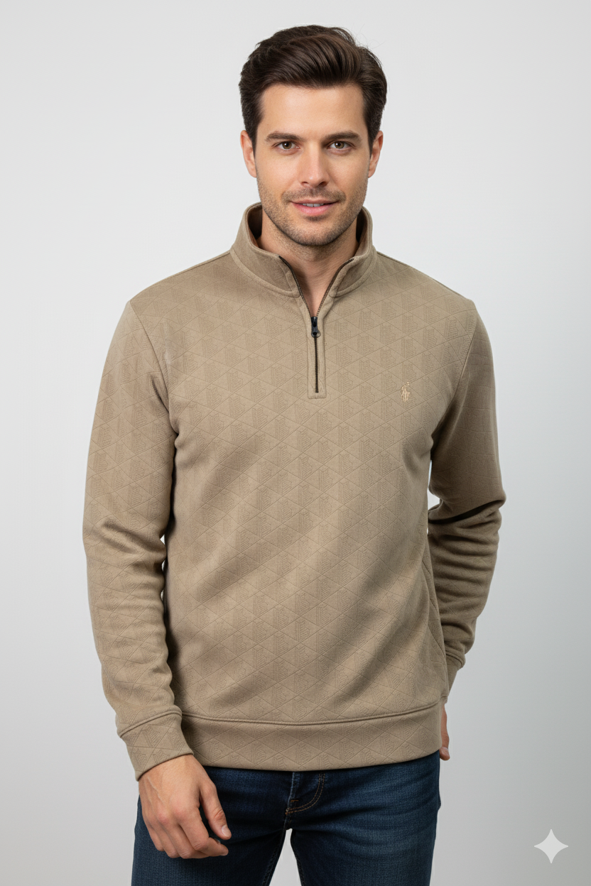 Man wearing a beige half-zip sweater on a light gray background