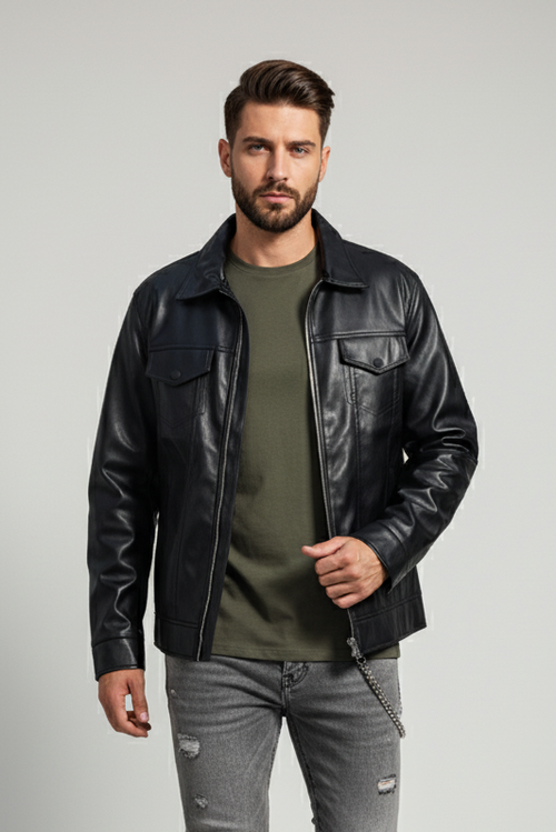 Man wearing a black leather jacket, green shirt, and gray jeans on a light gray background