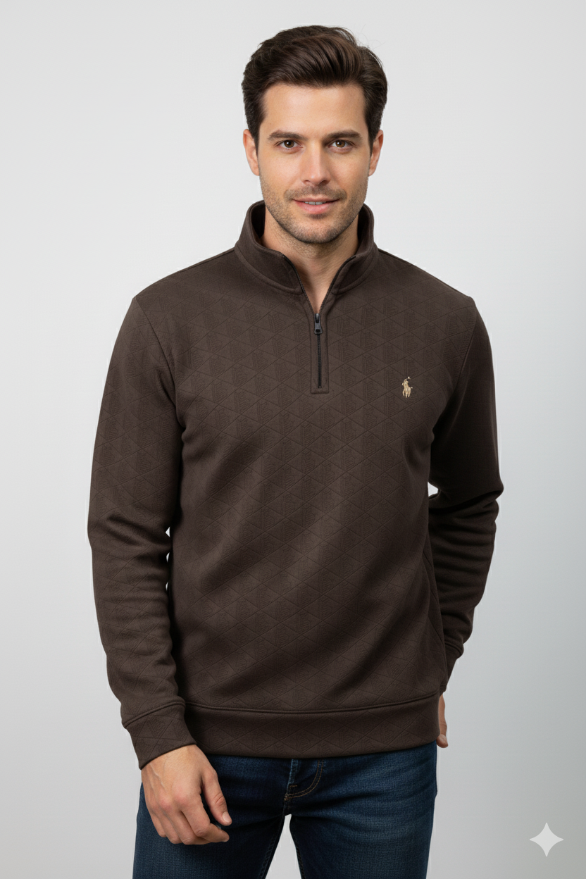 Man wearing a brown pullover with a logo on a light gray background
