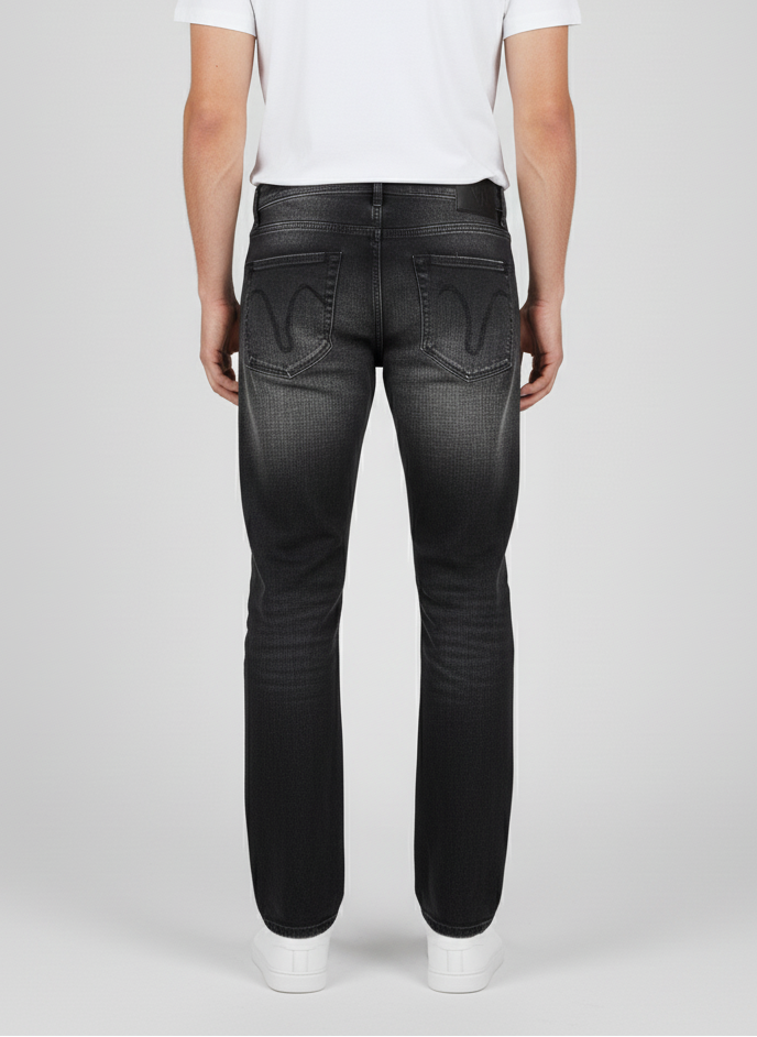 Person wearing black jeans on a white background