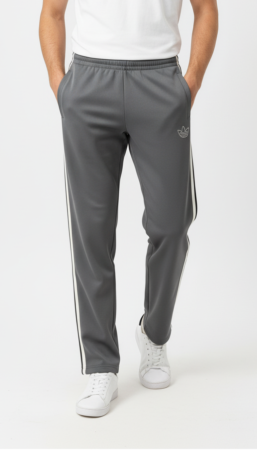 Man wearing a white t-shirt and gray track pants with white stripes on a white background